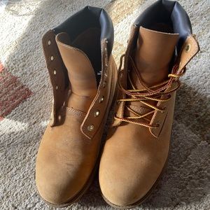 Timberland waterproof boots. Tan, size 5.5. I am normally a 7.5-8 women